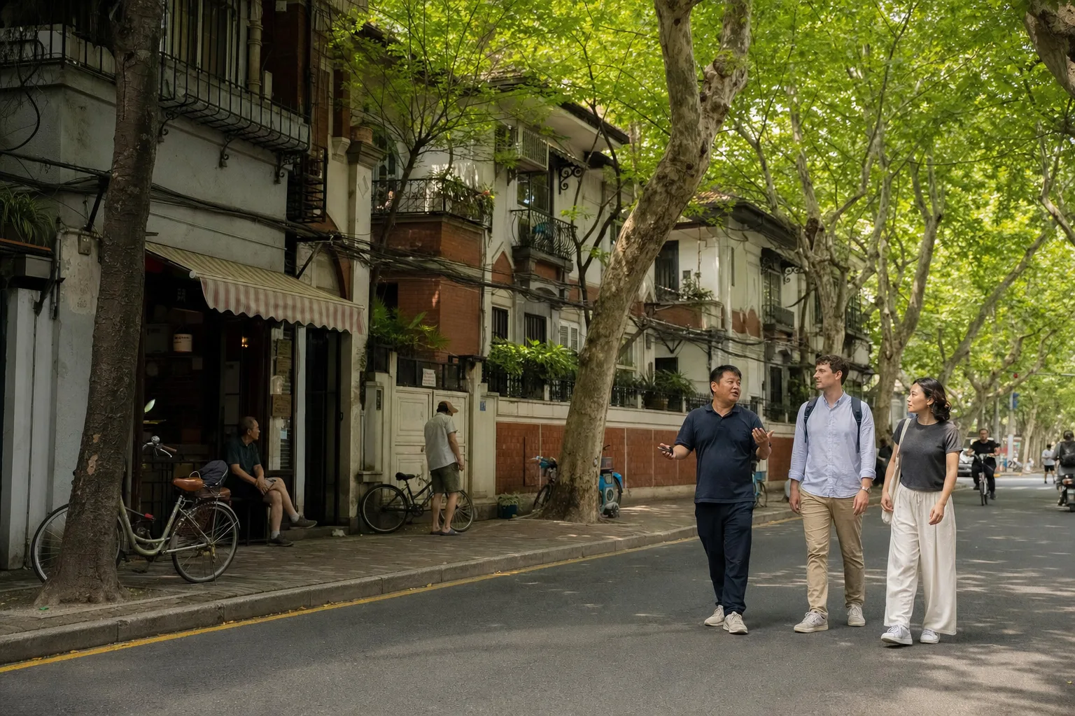 Travelers and a guide walking along a leafy residential street in Shanghai’s former French Concession