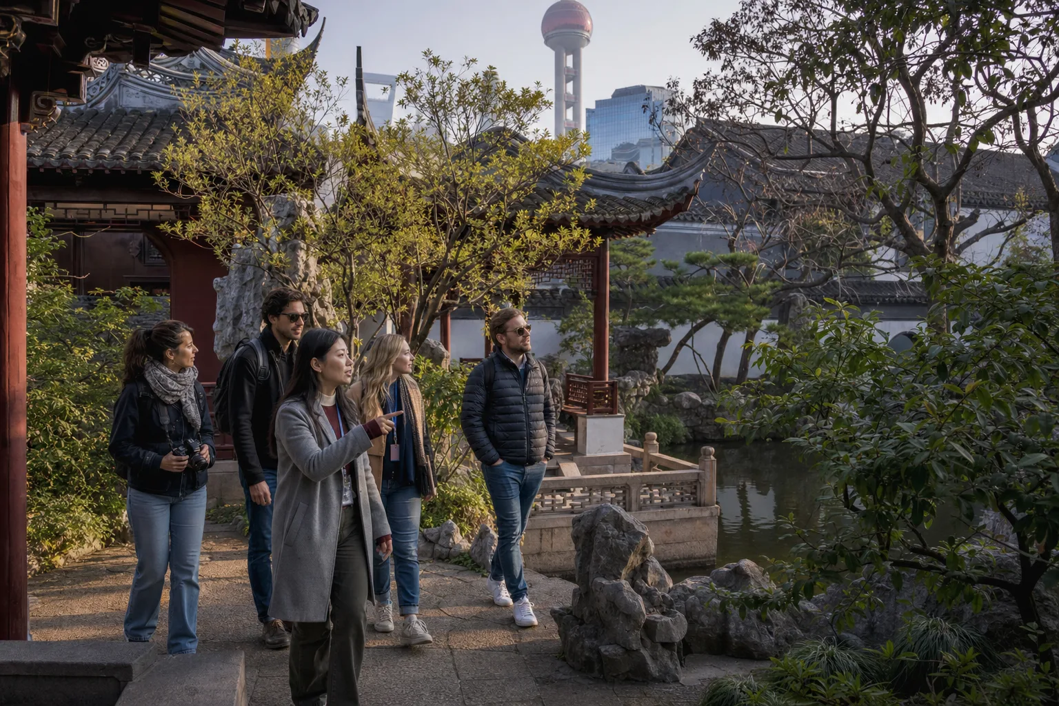 Travelers walking with a local guide through a classical Shanghai garden near the old city