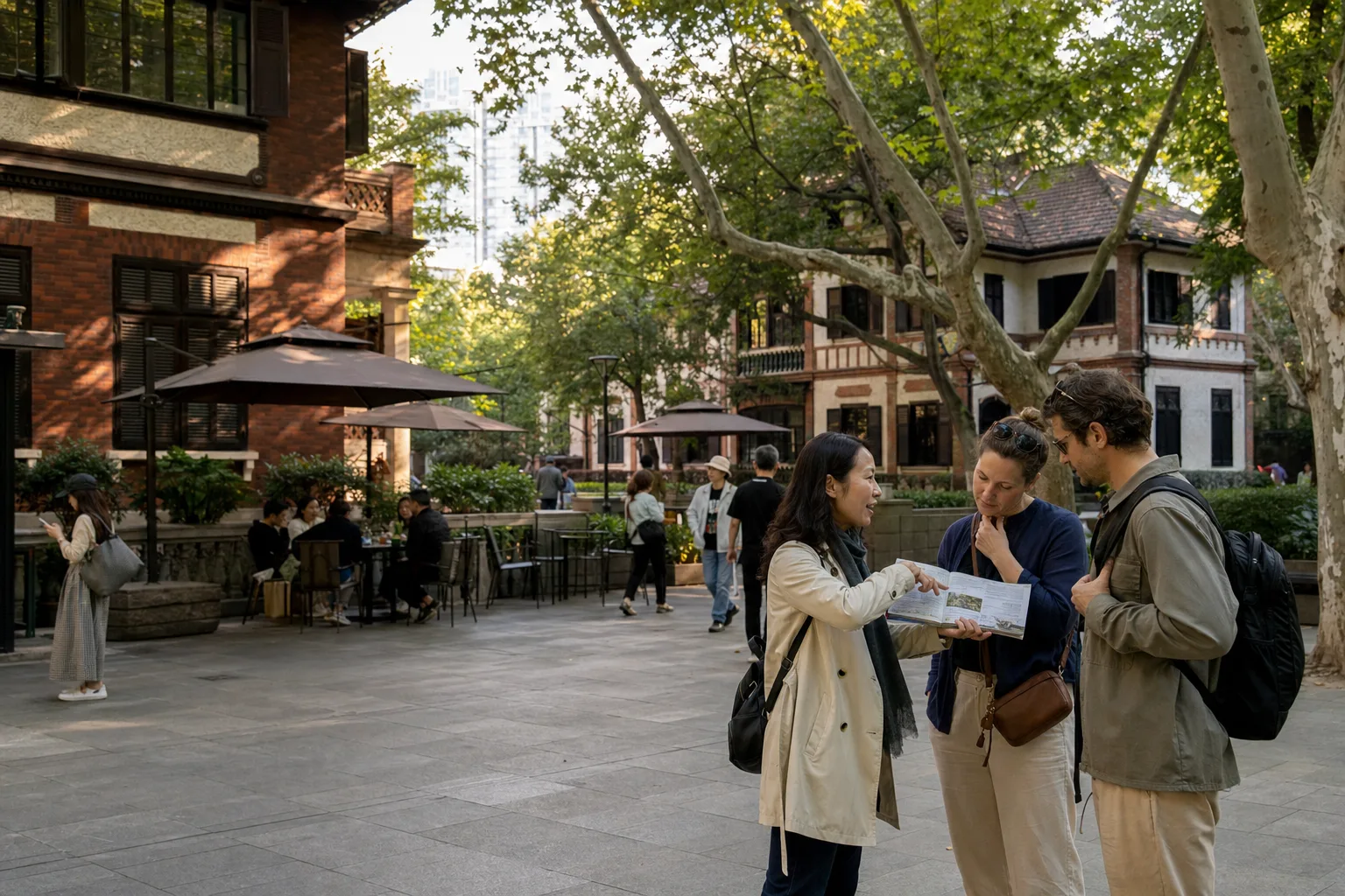 Travelers and a local guide reviewing historic garden villas in the public Sinan Mansions area